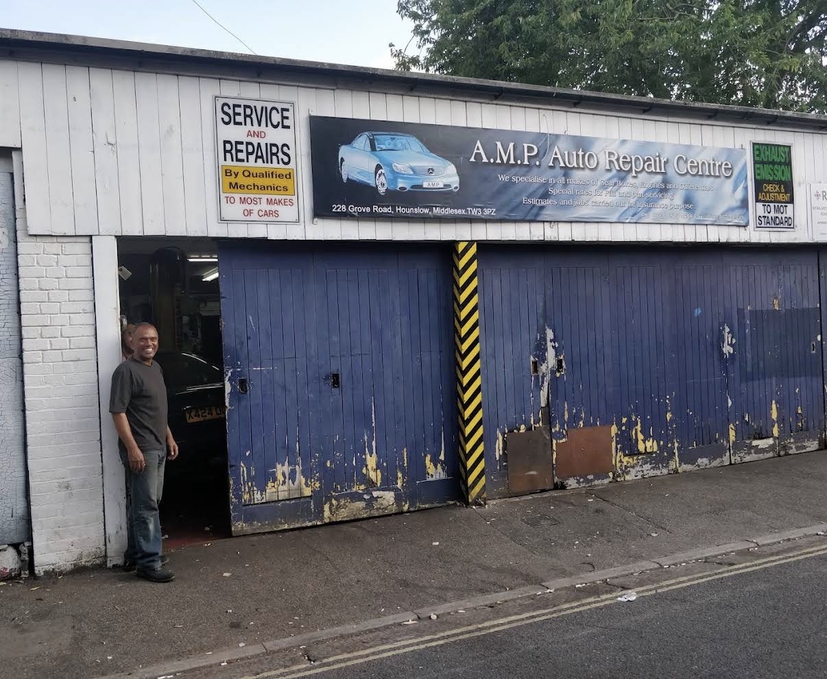 Farrukh, owner of AMP Auto Repair Centre, outside the garage at 228 Grove Road, Hounslow